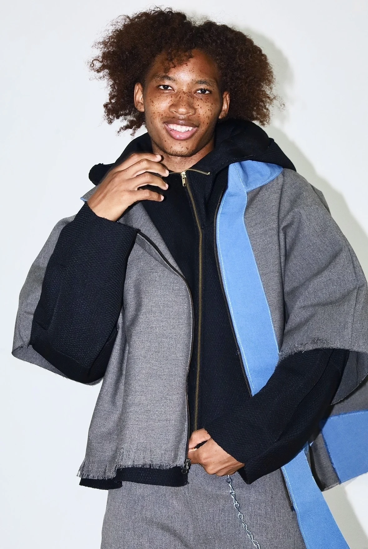 Front detail of grey and blue jacket